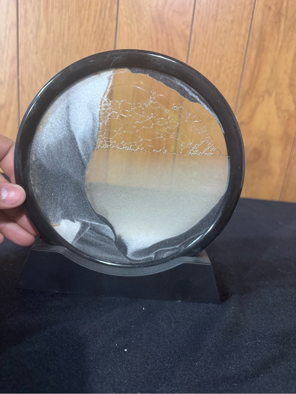 Round Sand Art Display in Black Frame with Gray, black, white sand